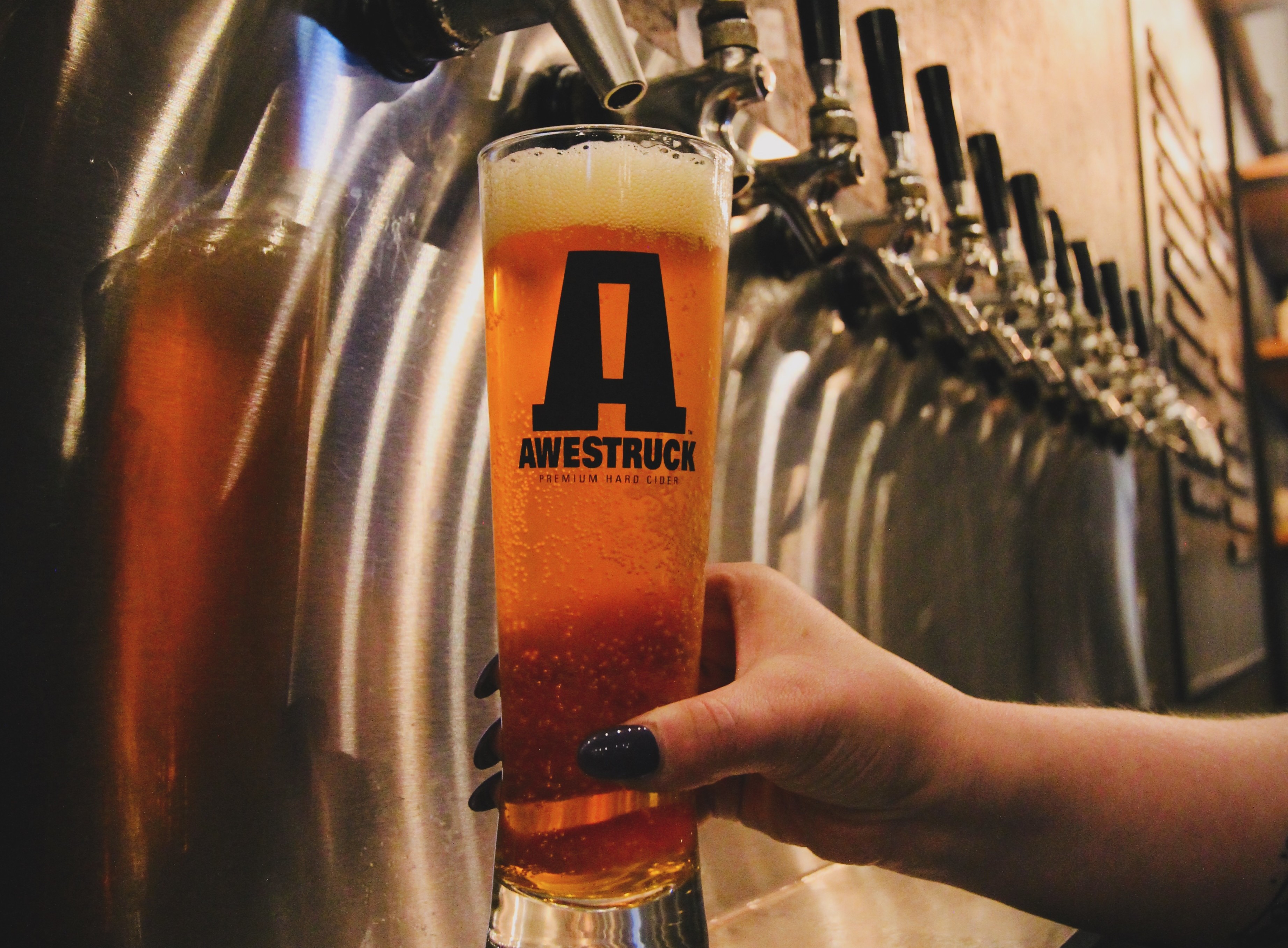 Taproom pour of Peach Ring flavored cider